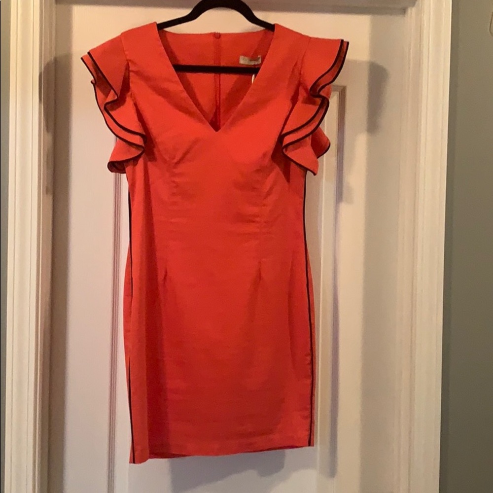 Coral ruffle sleeve dress.